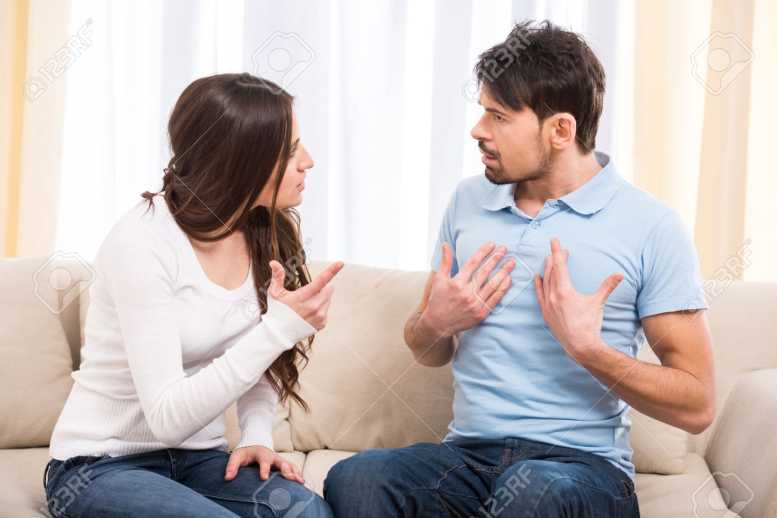 35700755-portrait-of-frustrated-couple-are-sitting-on-couch-and-are-quarreling-with-each-other-